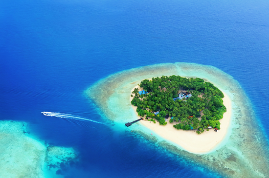 Small tropical island in the ocean, Maldives. Shot was taken from seaplane.